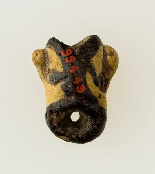Amulet in form of human face