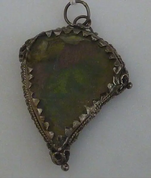 Silver heart-shaped reliquary case containing pieces of brocade, Italy, 1600-1799