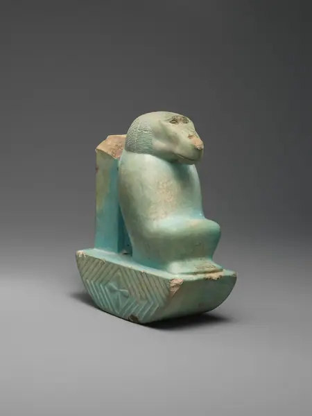Figure of baboon on a basket and with a pillar ( shebet offering)