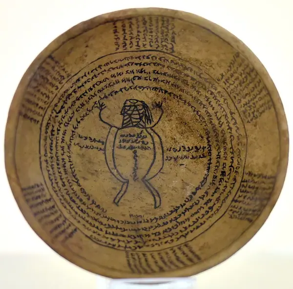 Incantation bowl, from Iraq, Aramaic inscription with a human figure.3rd to 7th century CE. Iraq Museum