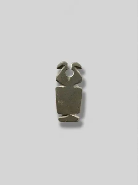 Amulet emphasizing a pair of horns