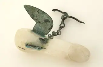 A Graeco-Roman phallic amulet made from alabaster with bronze wings, Pompeii, 100 BC - AD 100