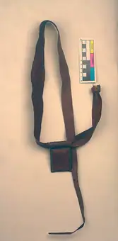 Belt with container and talisman